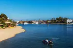 Newport Beach is a small city on the Pacific coast of southern California, right on the Pacific Coast Highway and noted for its beaches and surfing.