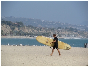 Surfer on beach at Dana Point on the Pacific Coast Highway