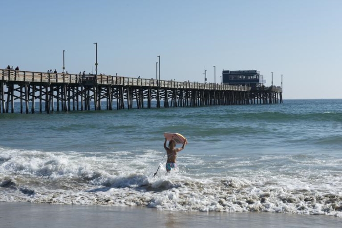 Surfing at Newport Beach in California
