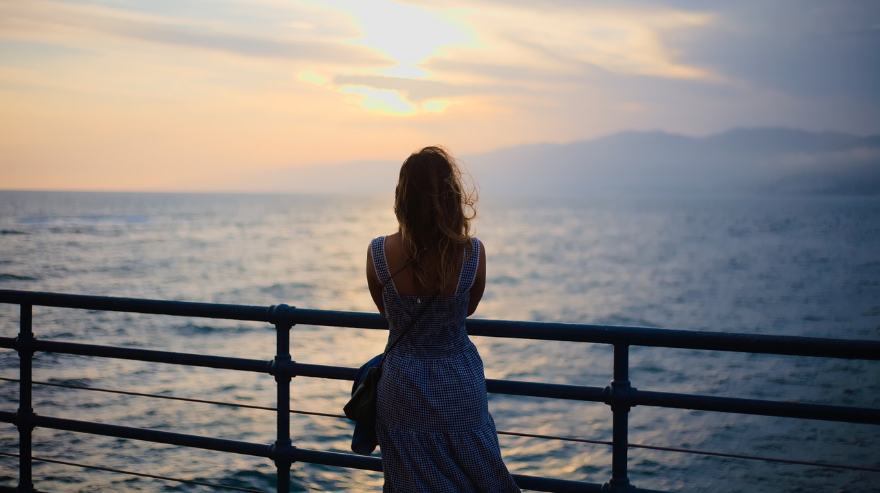Woman gazing out to sea in Santa Monica