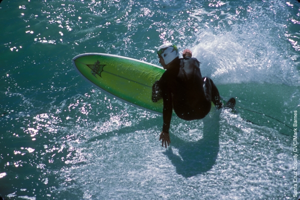 A surfer in Santa Cruz, California, from https://www.pacific-coast-highway-travel.com/Santa-Cruz.html