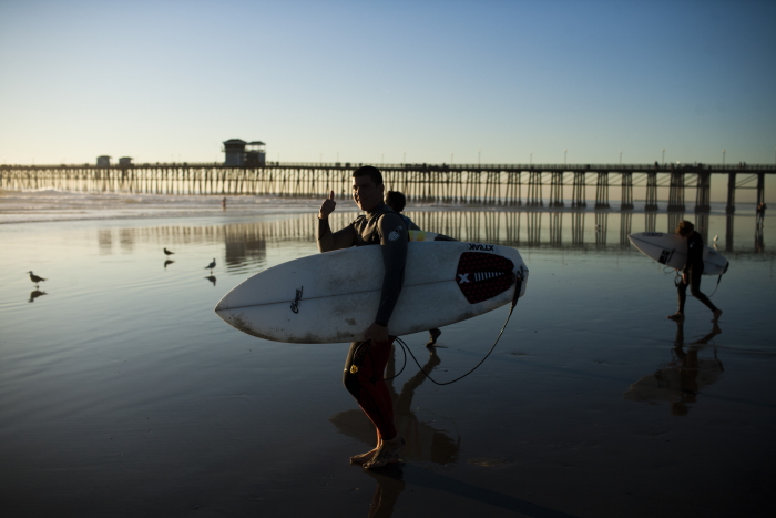 Surfers in Front of Oceanside Pier in Oceanside, southern California