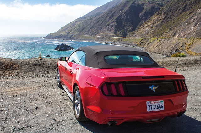 Red sports car parked off the Pacific Coast Highway