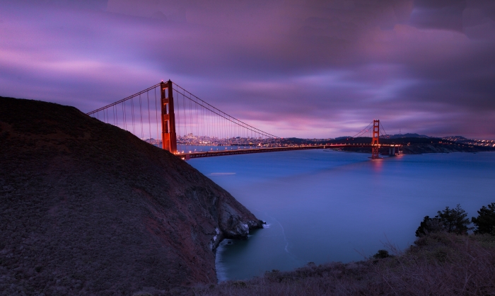 Photo of Golden Gate Bridge in San Francisco with purple sky
