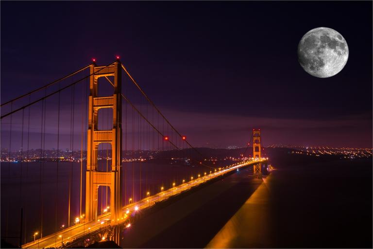 Photo of Golden Gate Bridge in San Francisco at night with huge full moon, maybe Photoshopped