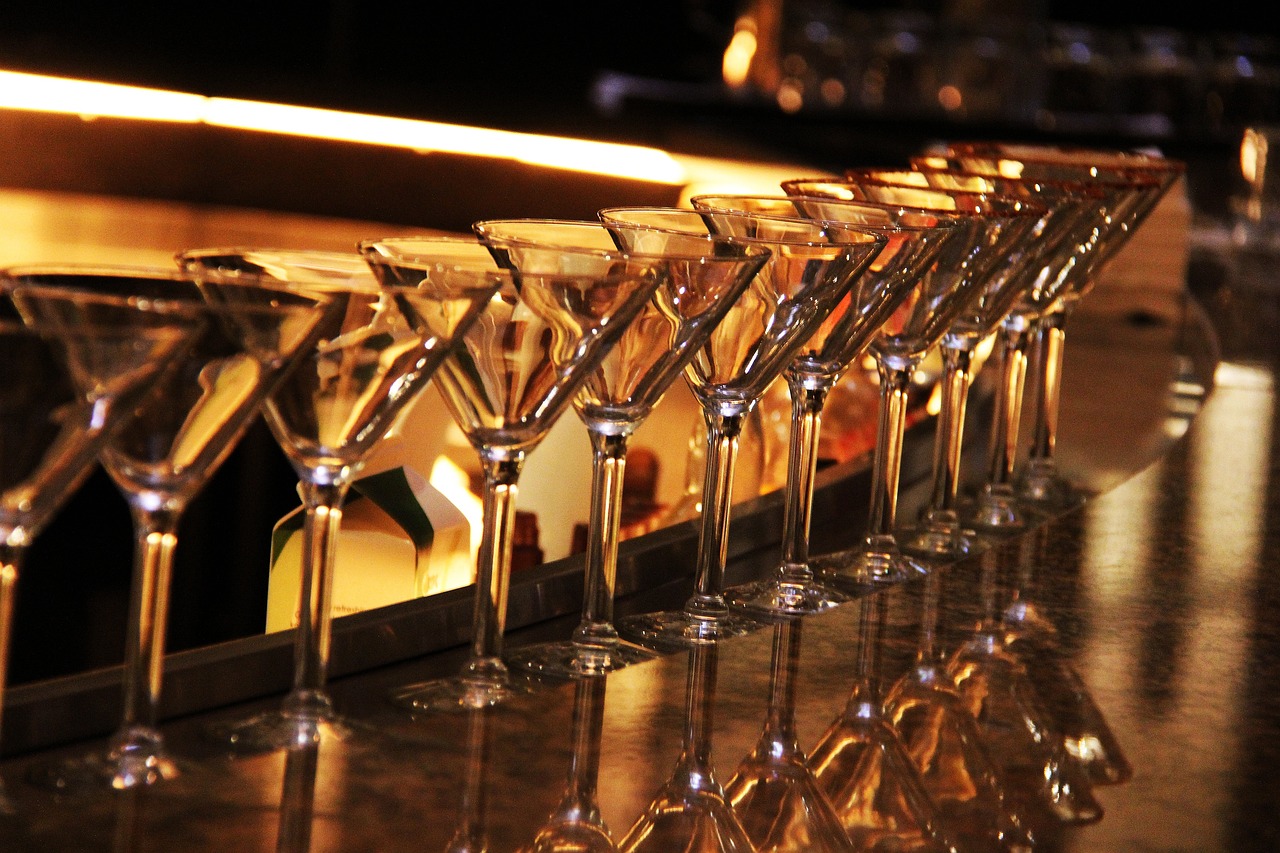 A row of Martini glasses on a bar