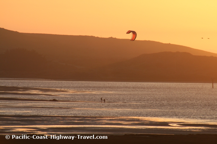 Parascending at sunset in Bodega Bay in California along the Pacific Coast Highway