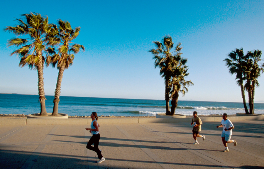 Joggers at a beach in Ventura, California