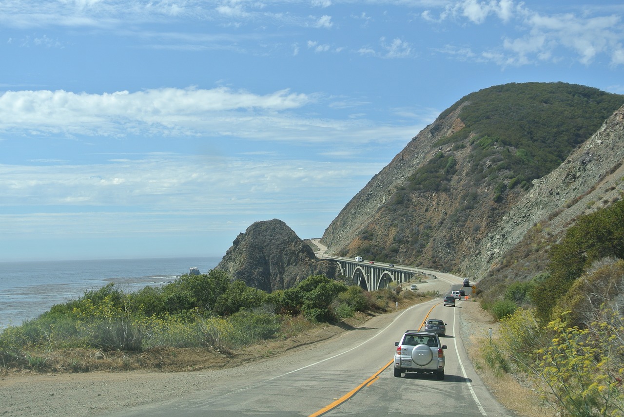 Cars driving the Pacific Coast Highway near Bixby Bridge