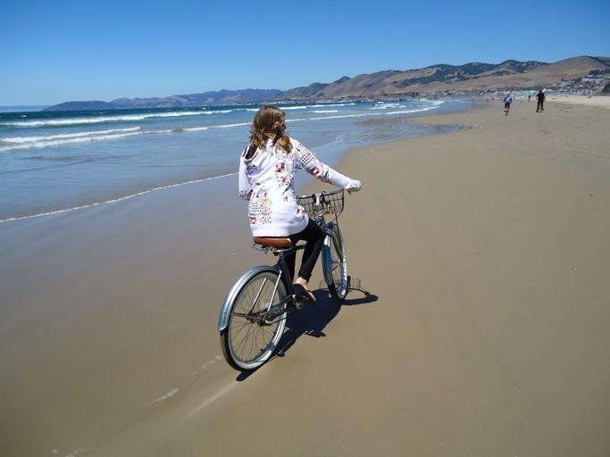 Riding a bike along Pismo Beach